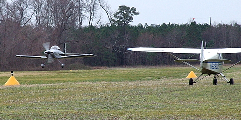 RV-8 on departure and a Piper PA-22-108 Tri-pacer taxi's.