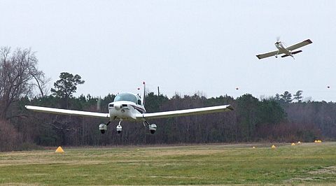 Grumman AA5B Tiger (front) and a RV (rear) departing.